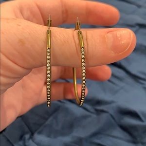 Brass colored earrings with small silver diamonds
